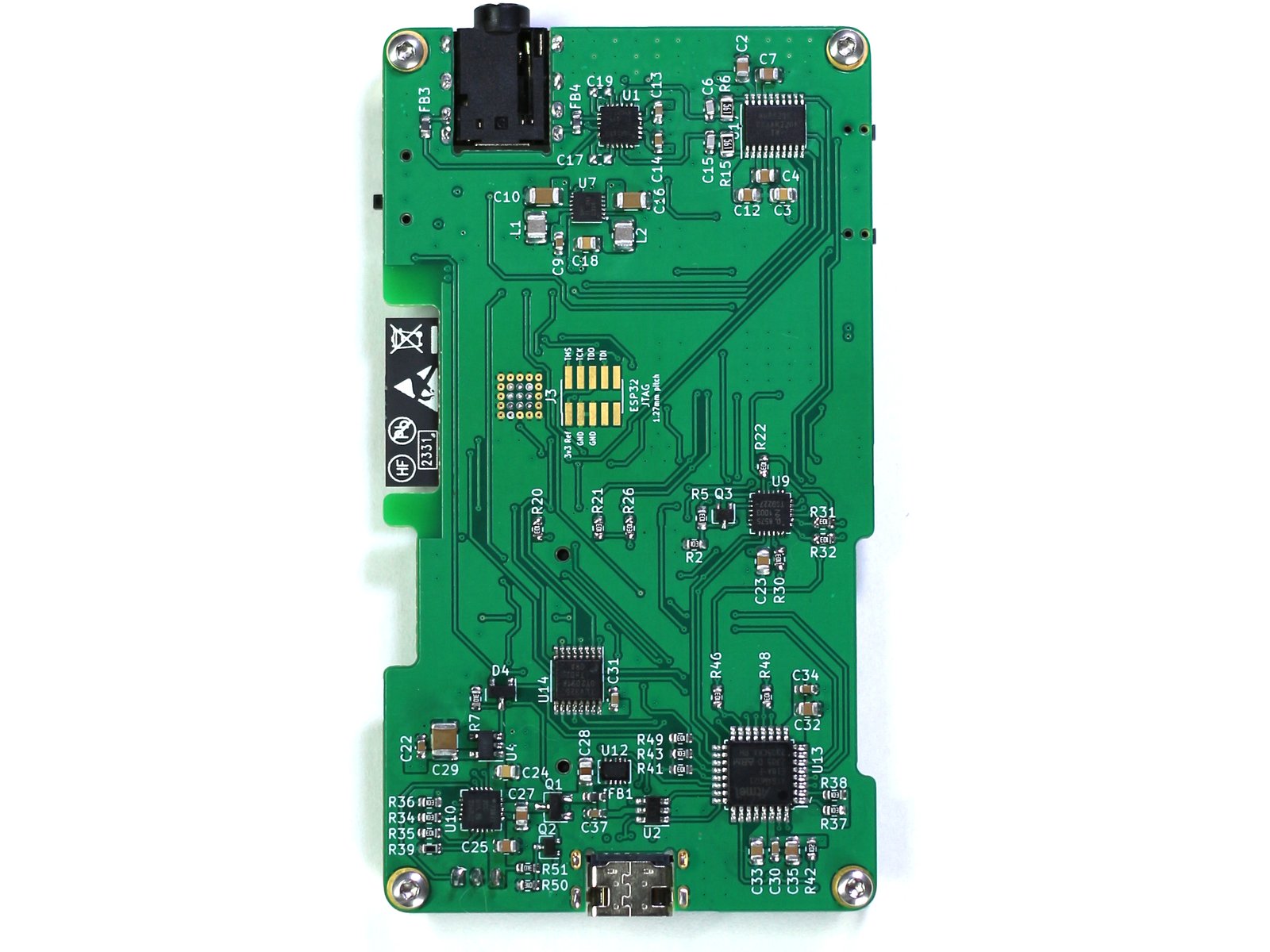 The reverse side of the same rectangular portrait-orientation PCB. It contains a large variety of small components.